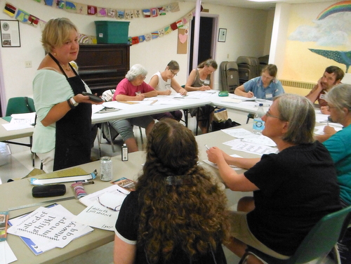 Penne Tompkins teaching calligraphy